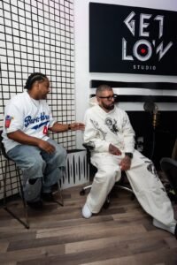 M1 Theking talking with the team at Get Low Studio